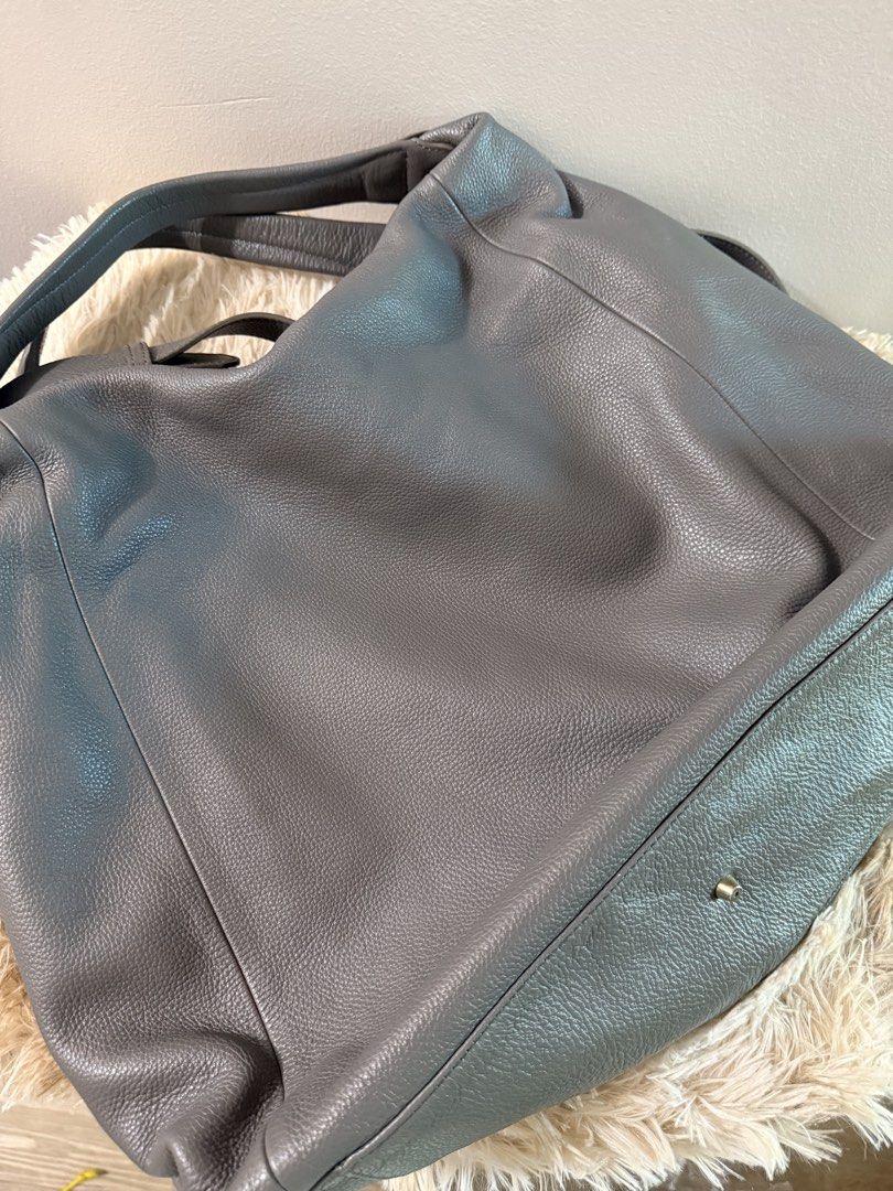 Furla grey pebbled leather hobo shoulder bag (Category: Luxury Bags & Wallets) located in Quezon City. Submitted by rosell.xoxo (Listing ID 1468366589, Image 2). Description: - Brand: Furla - Material: Premium grey pebbled leather - Straps: Comfortable double shoulder straps - Condition: Excellent with dustbag.