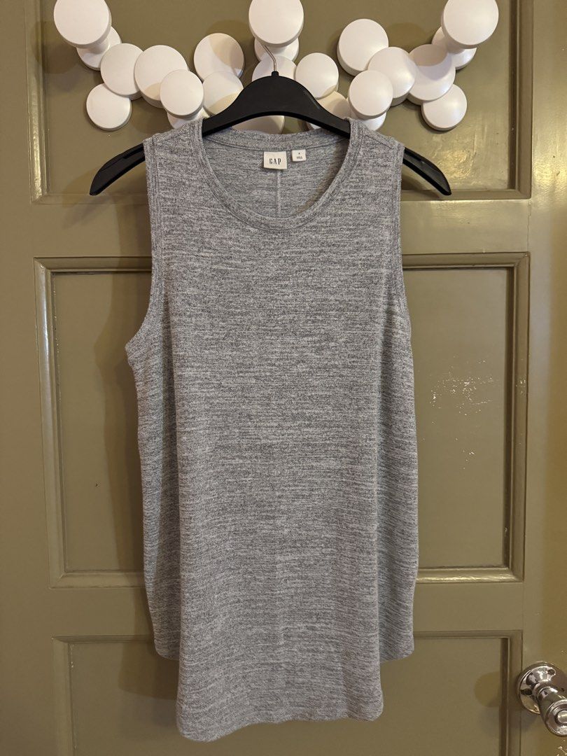 Gap Grey Sleeveless Tank Top Size S (Category: Sleeveless) located in Manila. Submitted by gabwie (Listing ID 1468408070, Image 3). Description: - Brand: Gap - Color: Grey marled - Size: S - Style: Sleeveless top with classic crew neckline and fitted cut - Details: Soft knit fabric with vertical back seam detail - Condition: Clean, excellent, and ready to wear - Versatility: Great basic piece for layering or warm weather.