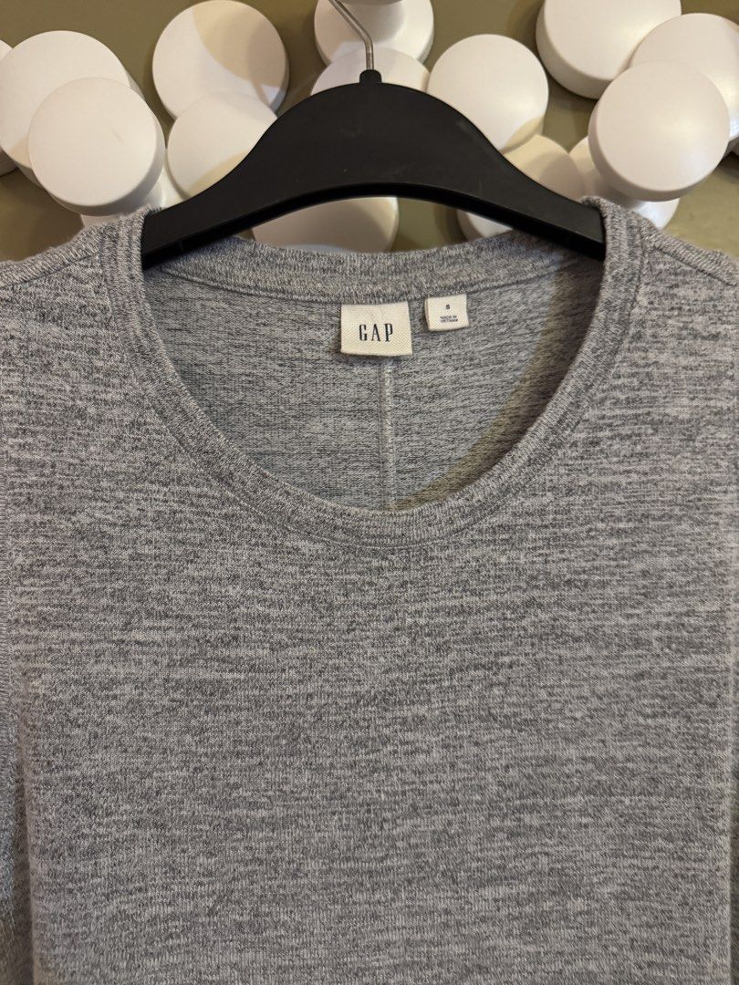 Gap Grey Sleeveless Tank Top Size S (Category: Sleeveless) located in Manila. Submitted by gabwie (Listing ID 1468408070, Image 1). Description: - Brand: Gap - Color: Grey marled - Size: S - Style: Sleeveless top with classic crew neckline and fitted cut - Details: Soft knit fabric with vertical back seam detail - Condition: Clean, excellent, and ready to wear - Versatility: Great basic piece for layering or warm weather.