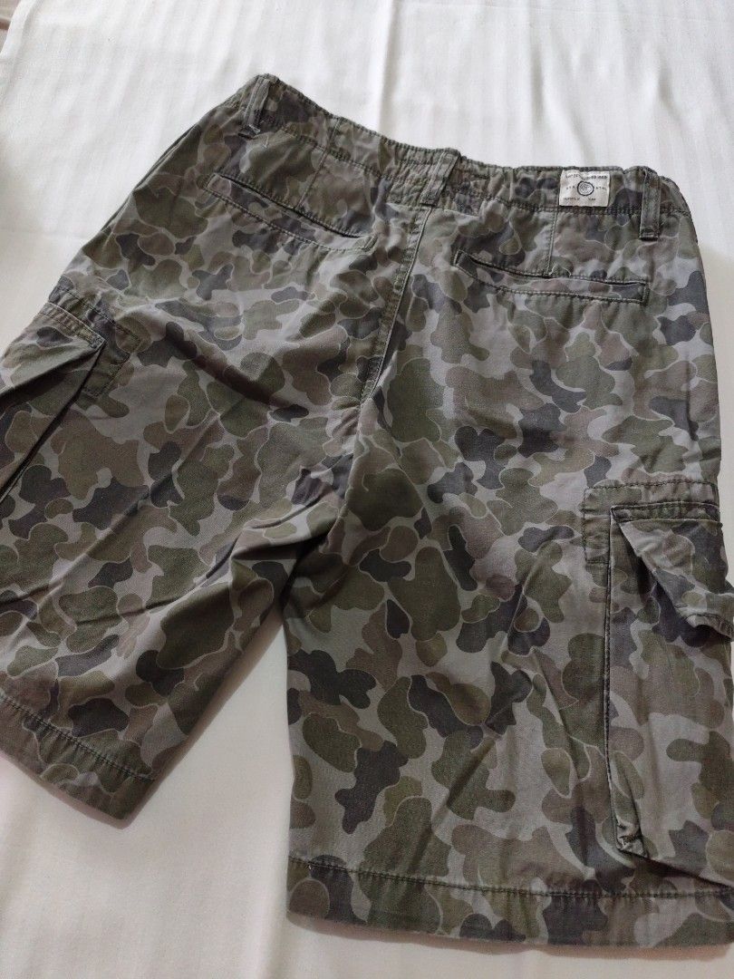 Gap Kids Camouflage Cargo Shorts Size 18 Regular (Category: Shorts) located in Malungon. Submitted by 2ndhandoriginals (Listing ID 1468302890, Image 2). Description: Waist: 39 inches Length: 19 inches - Brand: Gap Kids - Size: 18 Regular - Design: Green and grey all-over camouflage pattern - Pockets: Multiple functional side cargo pockets and back pockets - Closure: Button closure with a secure zipper fly - Adjustable waist garter.