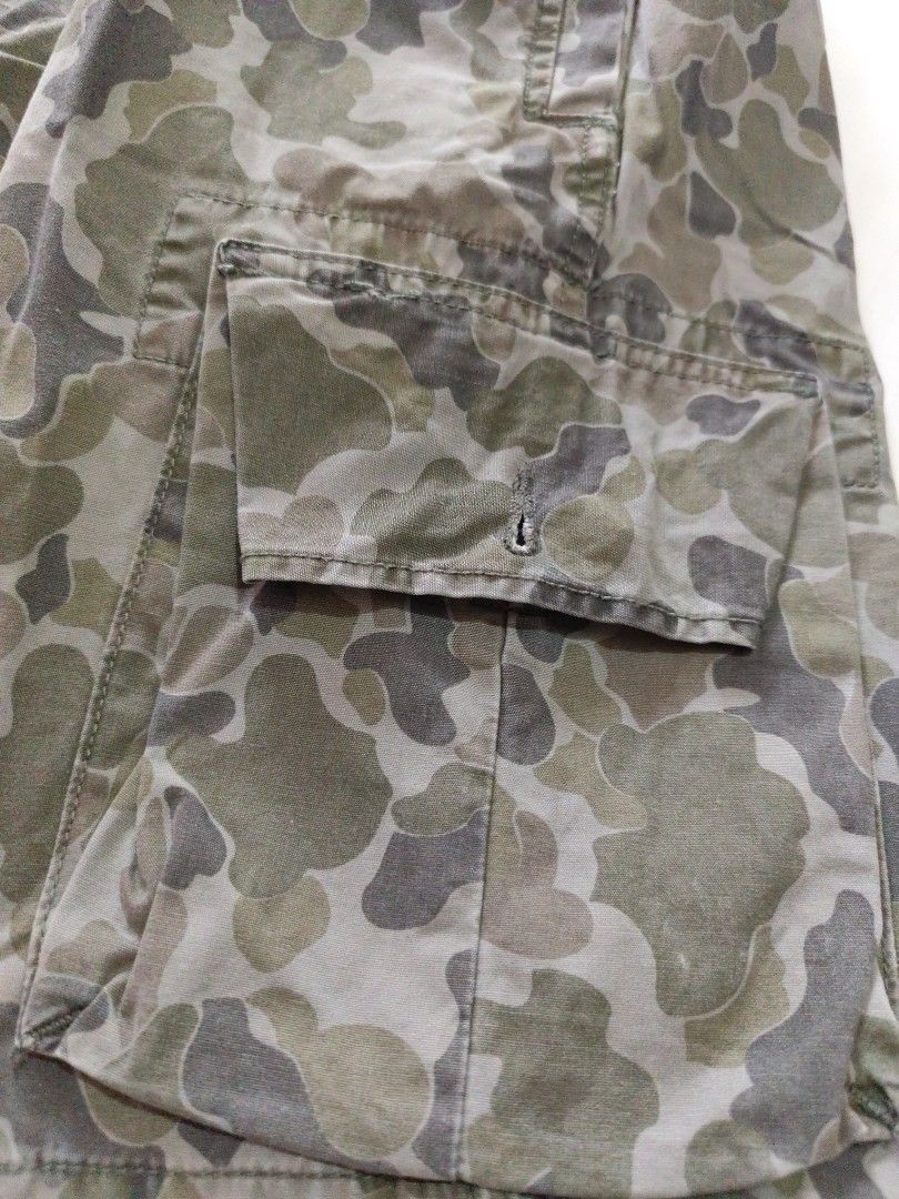 Gap Kids Camouflage Cargo Shorts Size 18 Regular (Category: Shorts) located in Malungon. Submitted by 2ndhandoriginals (Listing ID 1468302890, Image 3). Description: Waist: 39 inches Length: 19 inches - Brand: Gap Kids - Size: 18 Regular - Design: Green and grey all-over camouflage pattern - Pockets: Multiple functional side cargo pockets and back pockets - Closure: Button closure with a secure zipper fly - Adjustable waist garter.