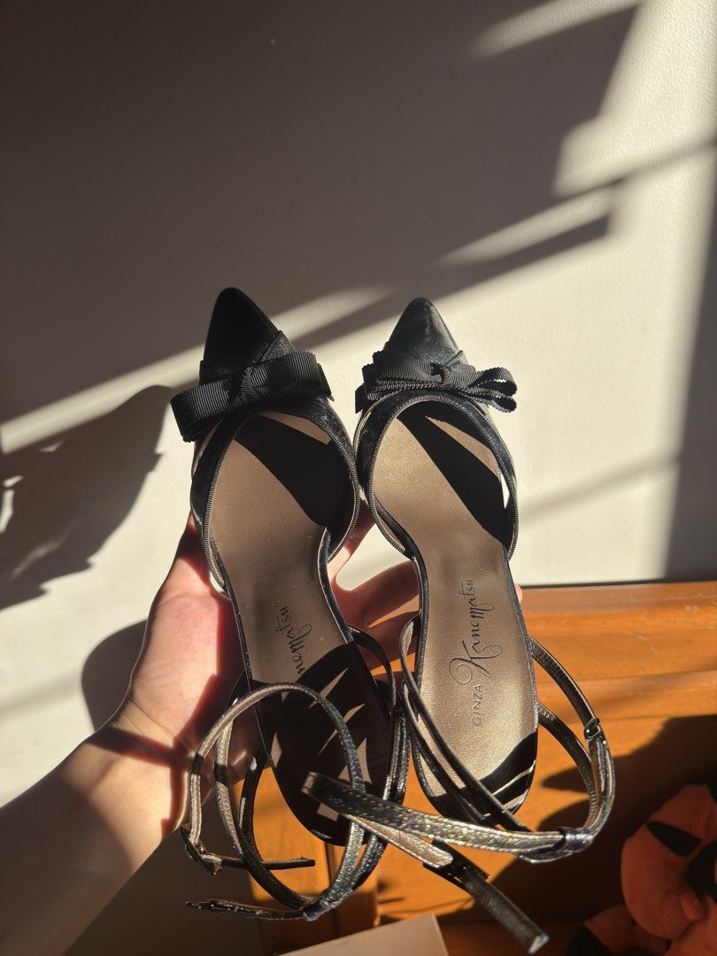 Ginza Kanematsu Black Bow Slingback Heels (Category: Heels) located in Quezon City. Submitted by ianabanana20 (Listing ID 1468359694, Image 3). Description: So chic!! never used, stored only. Perfect for office wear and even casual dates!! authentic!! bought for 10kish Comes with its orig box 10/10 condition - Brand: Ginza Kanematsu - Style: Slingback heels with slim stiletto heels - Color/Finish: Dark metallic - Details: Pointed toe with layered