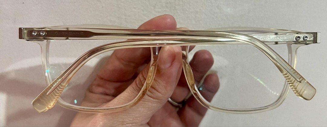 Giordano Transparent Clear Eyeglass Frames (Category: Sunglasses & Eyewear) located in Bacoor. Submitted by faith.hope.love28 (Listing ID 1468340780, Image 2). Description: Giordano clear transparent frames. Model GA02733 stamped inside the temple arm. Full-rim rectangular shape. Clear acetate material with a slight yellowing tint from age. Metal temples with engraved detailing near the hinges. Prescription lenses currently installed, easily swap