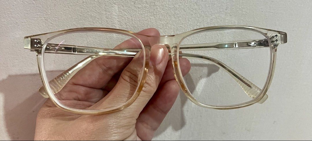 Giordano Transparent Clear Eyeglass Frames (Category: Sunglasses & Eyewear) located in Bacoor. Submitted by faith.hope.love28 (Listing ID 1468340780, Image 1). Description: Giordano clear transparent frames. Model GA02733 stamped inside the temple arm. Full-rim rectangular shape. Clear acetate material with a slight yellowing tint from age. Metal temples with engraved detailing near the hinges. Prescription lenses currently installed, easily swap
