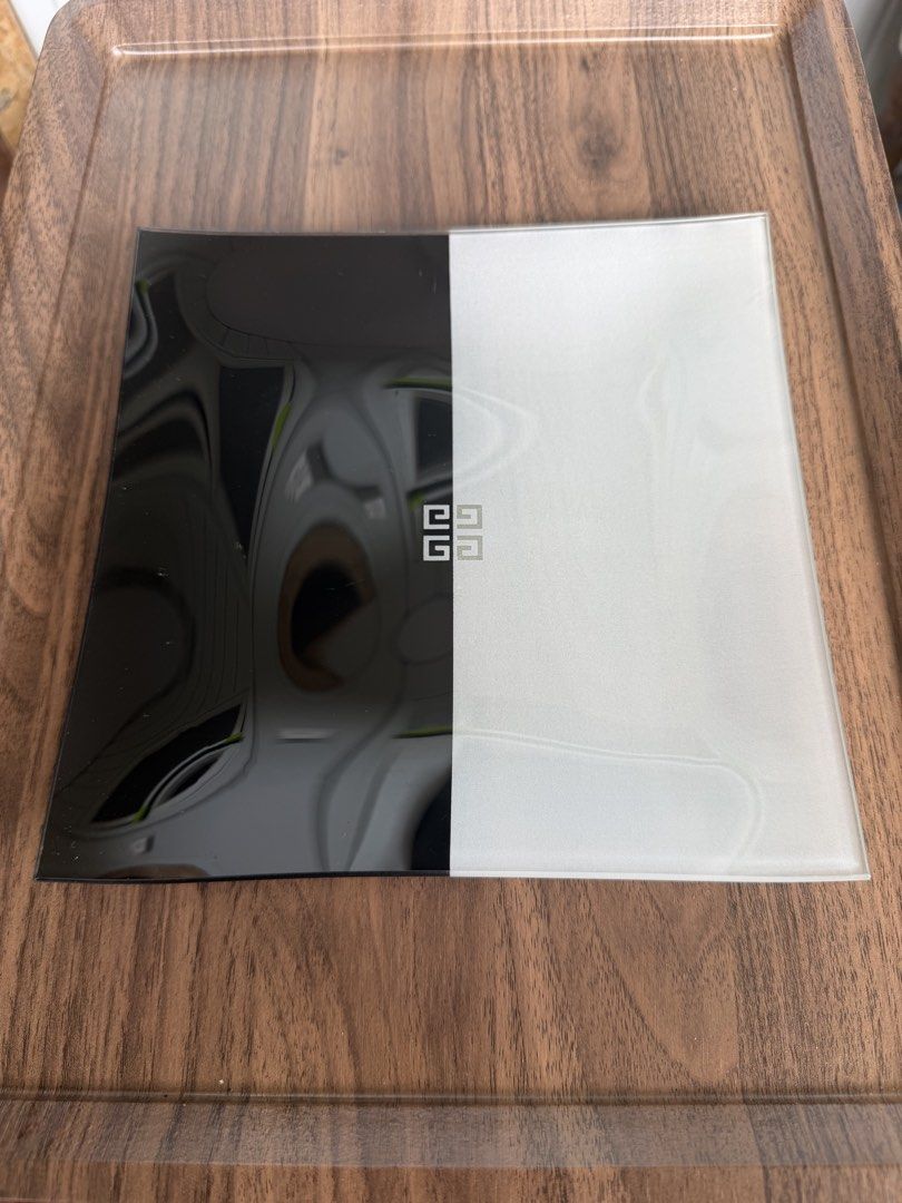 Givenchy Glass Tray Black White Monogram (Category: Dinnerware & Cutlery) located in Digos. Submitted by old_soul. (Listing ID 1468294916, Image 2). Description: - Authentic Givenchy decorative tray - Chic split black and white design with iconic center 4G monogram - Heavy square glass construction with slightly curved edges - Dual texture finish: smooth polished and frosted matte halves - Pristine condition: no chips, cracks, or flaws.