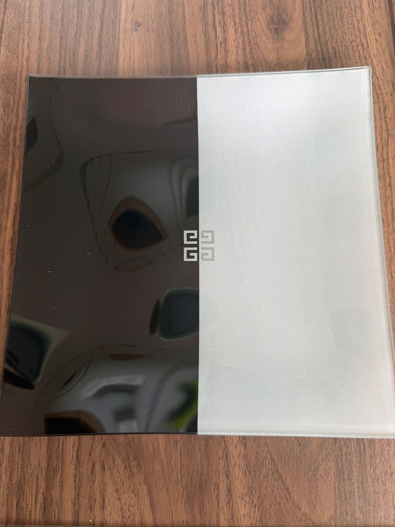 Givenchy Glass Tray Black White Monogram (Category: Dinnerware & Cutlery) located in Digos. Submitted by old_soul. (Listing ID 1468294916, Image 1). Description: - Authentic Givenchy decorative tray - Chic split black and white design with iconic center 4G monogram - Heavy square glass construction with slightly curved edges - Dual texture finish: smooth polished and frosted matte halves - Pristine condition: no chips, cracks, or flaws.