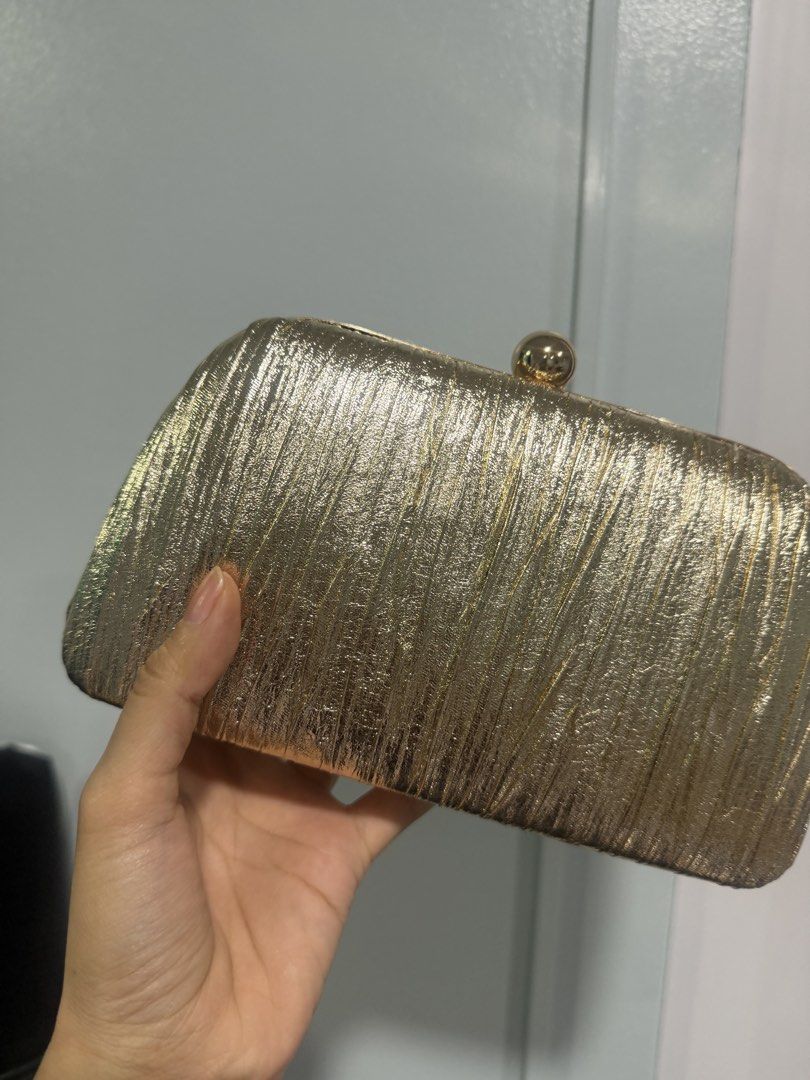 Gold clutch (Category: Clutches) located in Quezon City. Submitted by destashingmycloset (Listing ID 1468334700, Image 1). Description: .