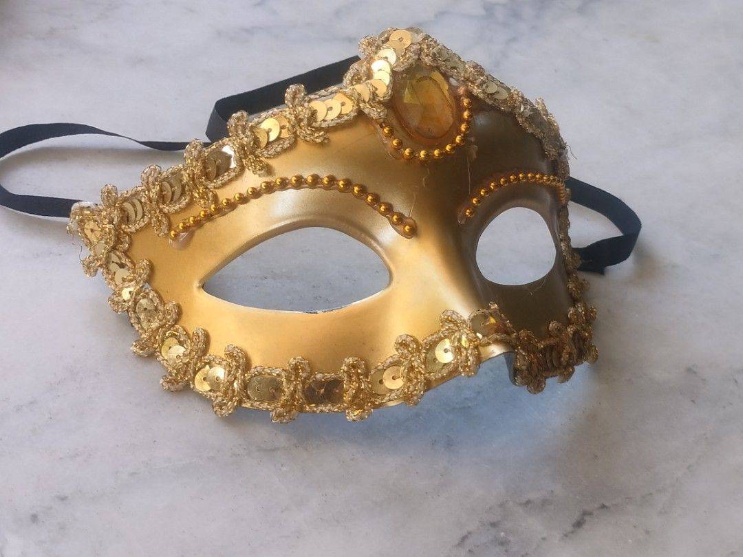 Gold Masquerade Mask with Sequins and Gem (Category: Occasions & Party Supplies) located in Las Pinas. Submitted by cozychic19 (Listing ID 1468381846, Image 1). Description: Gold masquerade mask with glitter, sequins, and a large center amber gem. Worn once, very clean, and comes with black satin ties..