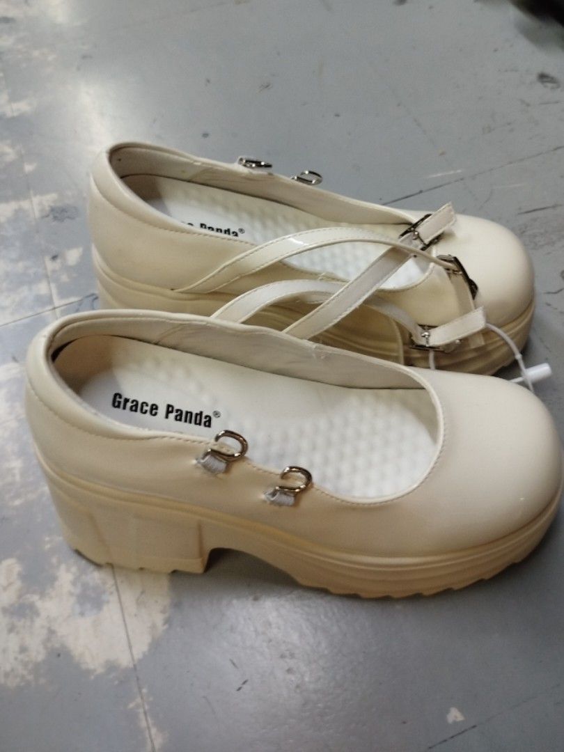 Grace Panda Mary Jane Platform Shoes Cream (Category: Heels) located in Quezon City. Submitted by cuteitemsonlyyy (Listing ID 1468428951, Image 3). Description: - Brand: Grace Panda - Style: Cream patent Mary Jane platform shoes with chunky block heel - Soles: Thick lug soles with minimal wear - Closure: Double buckled straps - Comfort: Cushioned white insoles with branding - Condition: Clean, excellent pre-loved condition.