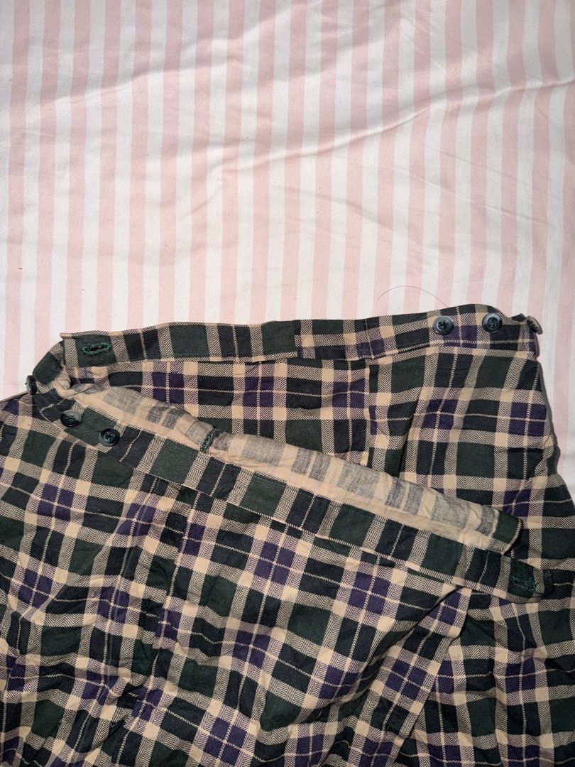 Green Purple Plaid Wrap Skirt (Category: Skirts) located in Taguig. Submitted by deguzmanke83356 (Listing ID 1468361284, Image 3). Description: - Color: Dark green, purple, and beige plaid - Style: Wrap skirt with adjustable button waist closure - Fabric: Lightweight and comfortable - Perfect for: Casual everyday wear or schoolgirl-inspired looks.