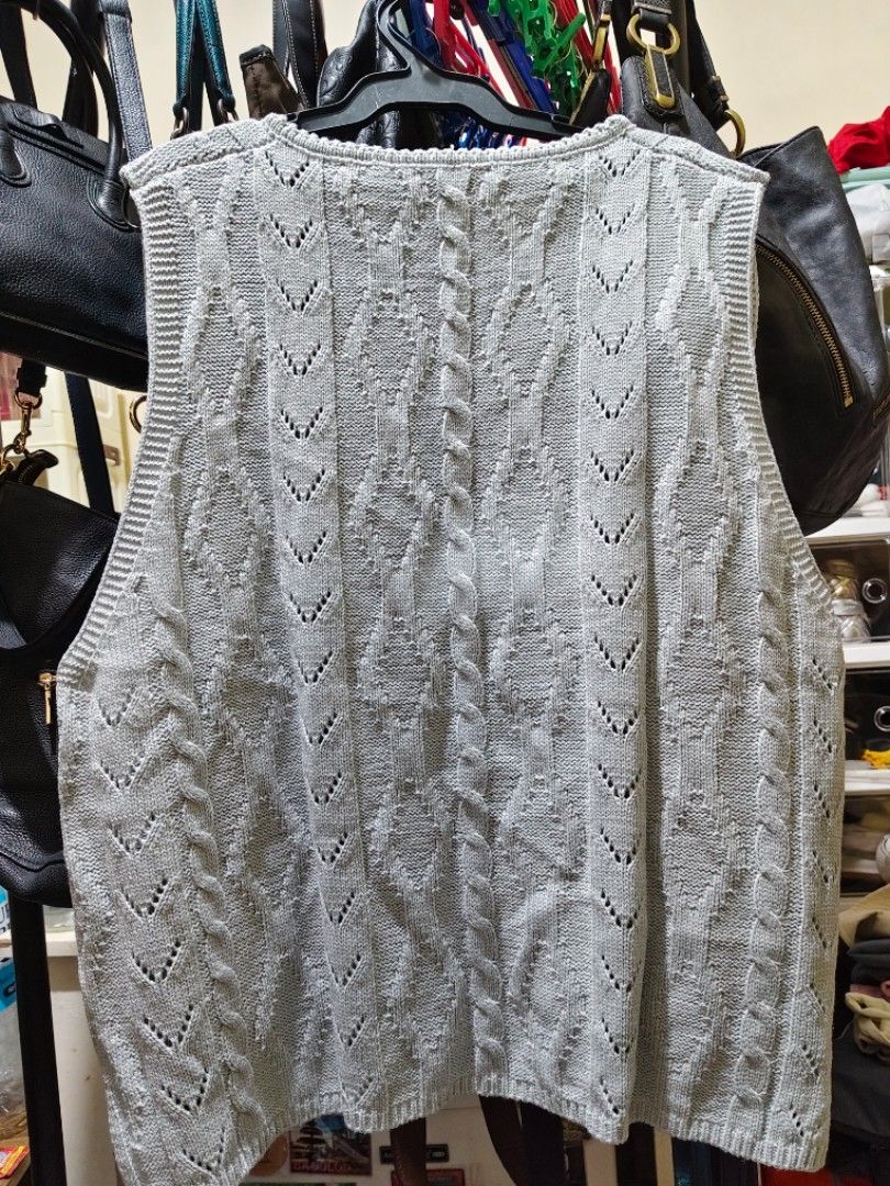 Grey cable knit button-up vest (Category: Sleeveless) located in Munoz. Submitted by harm0nica337 (Listing ID 1468423554, Image 2). Description: Bust:45 - Style: Sleeveless button-up vest with classic round neck - Design: Detailed cable knit and openwork diamond pattern - Finish: Ribbed trim on neckline, armholes, and hem - Versatility: Great for layering over shirts or wearing solo MOP: Gcash (price+SF) j&t express.