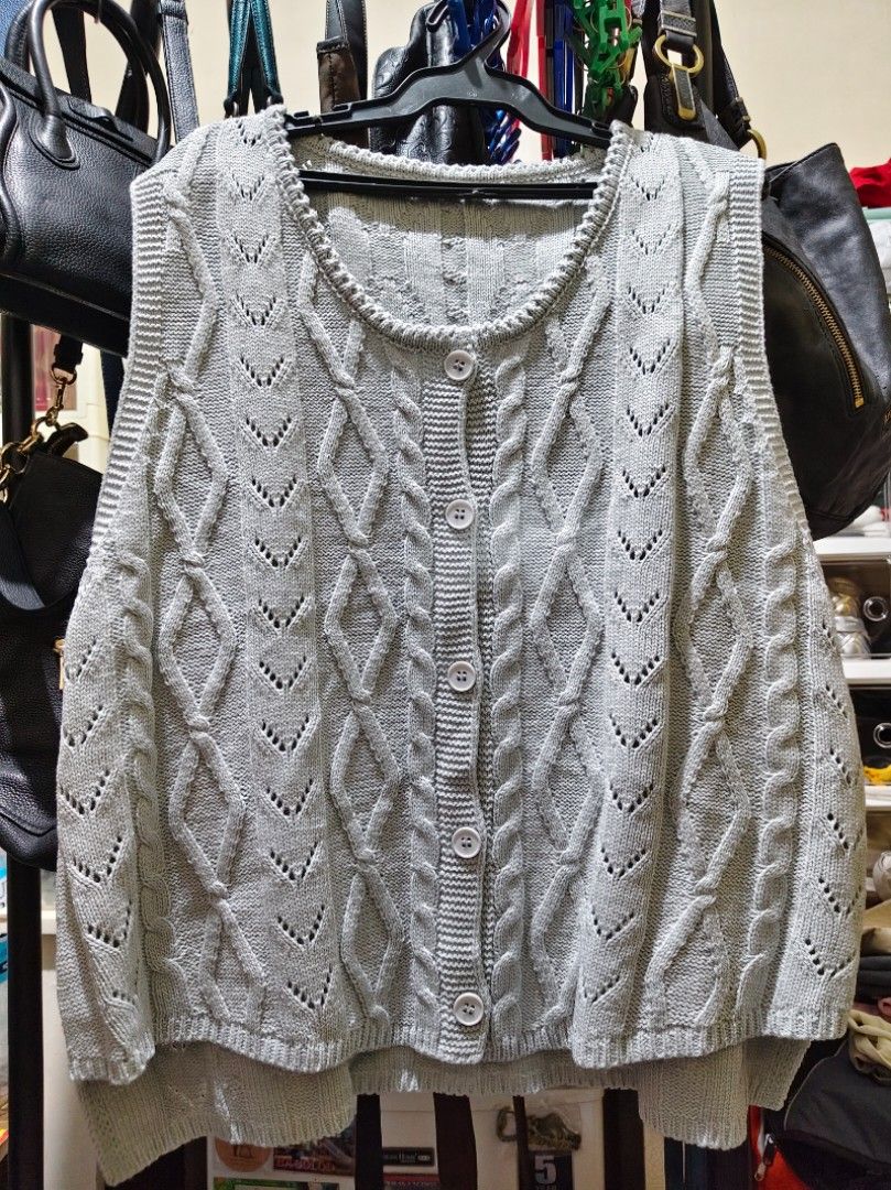 Grey cable knit button-up vest (Category: Sleeveless) located in Munoz. Submitted by harm0nica337 (Listing ID 1468423554, Image 1). Description: Bust:45 - Style: Sleeveless button-up vest with classic round neck - Design: Detailed cable knit and openwork diamond pattern - Finish: Ribbed trim on neckline, armholes, and hem - Versatility: Great for layering over shirts or wearing solo MOP: Gcash (price+SF) j&t express.