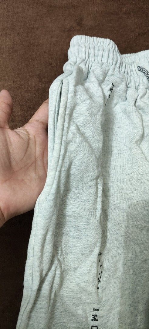 Grey Joggers Sweatpants with Side Lettering Print (Category: Joggers) located in Manila. Submitted by snz_shop (Listing ID 1468472636, Image 3). Description: - Material: Soft and cozy cotton blend - Fit: Tapered fit with cuffed ankles and elastic waistband - Details: Adjustable dark drawstring and bold 'I'M CLASSY' print down the left leg - Pockets: Deep side pockets on both hips - Style: Casual lounge pants, ideal for everyday wear.