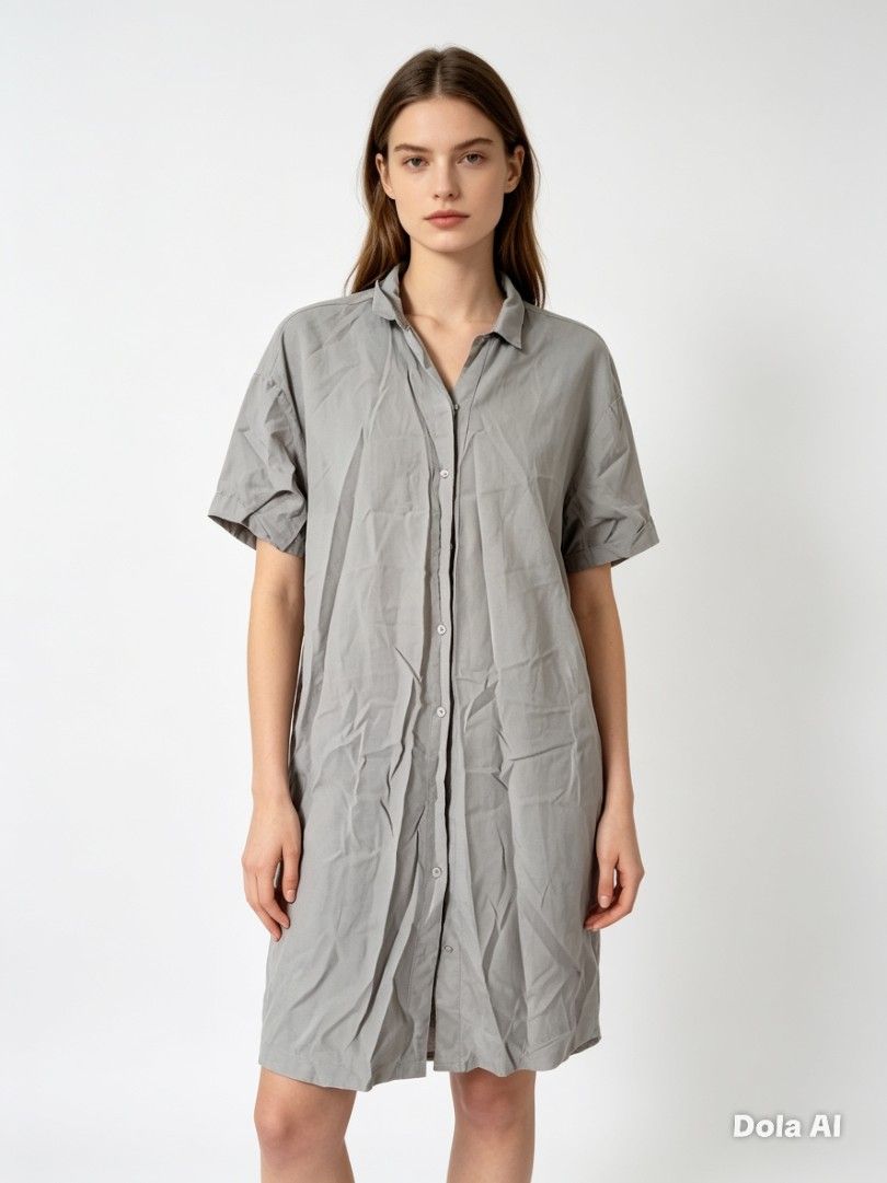 Cotton Dress Grey Short Sleeve Button Down Shirt Dress (Category: Dresses) located in Manila. Submitted by f.s_prelov3d (Listing ID 1468352590, Image 1). Description: - Color: Grey - Length: Above the knee - Material: Lightweight cotton - Design: Classic collar, full front button placket, short loose sleeves - Fit: Relaxed straight fit - Style: Casual everyday wear, easy throw-on piece - Note: Slightly wrinkled from storage.