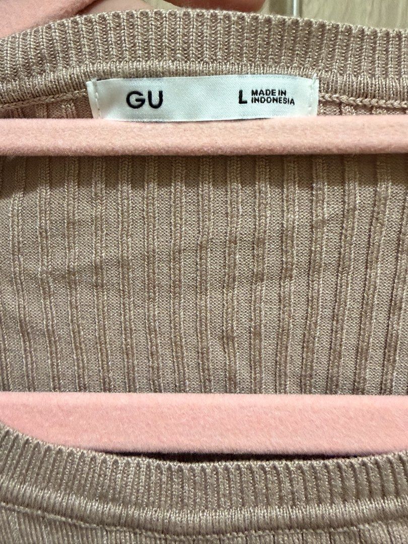 GU Ribbed Knit Sweater Size L (Category: Longsleeves) located in Manila. Submitted by anj_1414 (Listing ID 1468488191, Image 2). Description: - Brand: GU - Style: Ribbed knit sweater - Color: Soft brownish pink - Size: L (tag attached) - Material: Comfortable stretch knit, Made in Indonesia - Condition: Clean, nicely kept, and ready to wear - Versatility: Perfect everyday top that pairs easily with jeans or skirts.