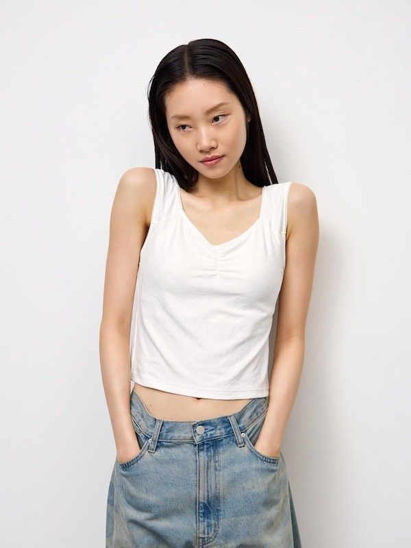 GU White Bra Tank Top Size M (Category: Sleeveless) located in Quezon City. Submitted by curatedbymissgee (Listing ID 1468292379, Image 1). Description: - Brand: GU - Item: Bra tank top - Color: Off-white - Size: M (Brand new with original tag) - Features: Built-in cups (no bra needed), textured fabric, gathered front detail - Style: Comfortable, perfect for daily wear or layering.