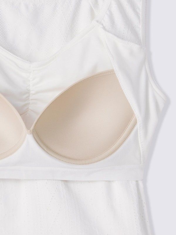 GU White Bra Tank Top Size M (Category: Sleeveless) located in Quezon City. Submitted by curatedbymissgee (Listing ID 1468292379, Image 3). Description: - Brand: GU - Item: Bra tank top - Color: Off-white - Size: M (Brand new with original tag) - Features: Built-in cups (no bra needed), textured fabric, gathered front detail - Style: Comfortable, perfect for daily wear or layering.