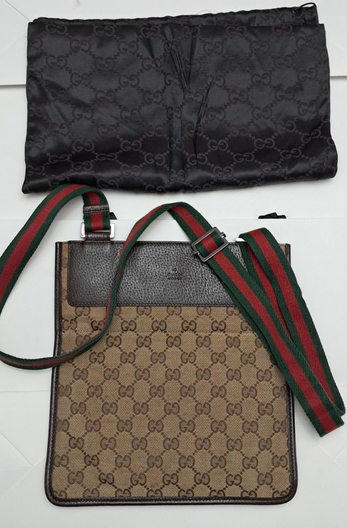 Gucci GG Canvas Web Messenger Bag with Dust Bag (Category: Luxury Bags & Wallets) located in Manila. Submitted by myrabundoc63934 (Listing ID 1468359145, Image 2). Description: - Authentic Gucci messenger bag in classic GG monogram canvas - Brown leather trim with iconic green and red web strap - Silver-tone hardware and clean brown fabric interior with zip pocket - Condition: Clean overall, with solid leather edges and strap - Inclusions: Origin