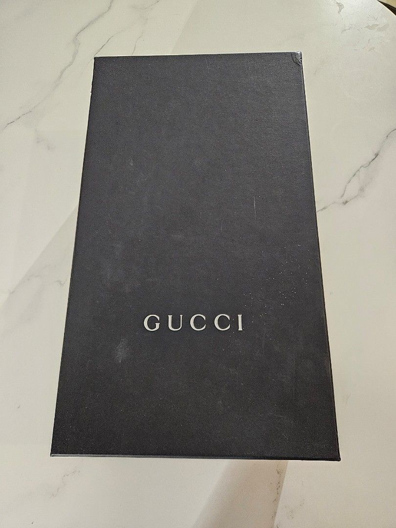 GUCCI Guccissima Dark Blue Loafers (Category: Dress Shoes) located in Mandaue City. Submitted by robertnpompompurin (Listing ID 1468320177, Image 3). Description: Was given as a graduation gift. Tried it twicw and realised it wasn't my style. Gucci Guccissima Dark Blue Moccasins - Color & Material: Dark Blue leather with debossed micro-GG pattern - Details: Leather strap, gold interior branding, Made in Italy - Condition: Minor creasing from hand