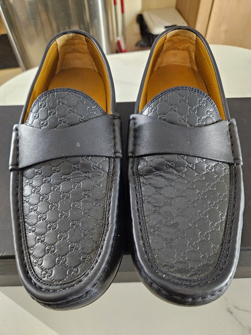 GUCCI Guccissima Dark Blue Loafers (Category: Dress Shoes) located in Mandaue City. Submitted by robertnpompompurin (Listing ID 1468320177, Image 2). Description: Was given as a graduation gift. Tried it twicw and realised it wasn't my style. Gucci Guccissima Dark Blue Moccasins - Color & Material: Dark Blue leather with debossed micro-GG pattern - Details: Leather strap, gold interior branding, Made in Italy - Condition: Minor creasing from hand