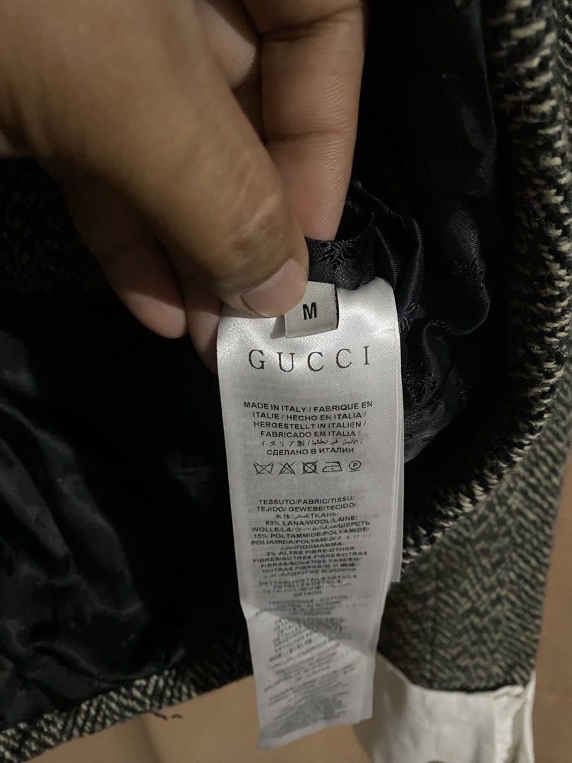 Gucci Herringbone Tweed Jacket (Category: Coats, Jackets and Outerwear) located in Manila. Submitted by why_notph (Listing ID 1468420158, Image 3). Description: - Brand: Gucci - Style: Cropped jacket in black & white herringbone wool - Details: Black velvet stand-up collar and matching pocket trims - Accents: Gold-tone crest buttons on front and white cotton cuffs - Interior: Black monogram pattern lining - Origin: Made in Italy - Size: Medium - 