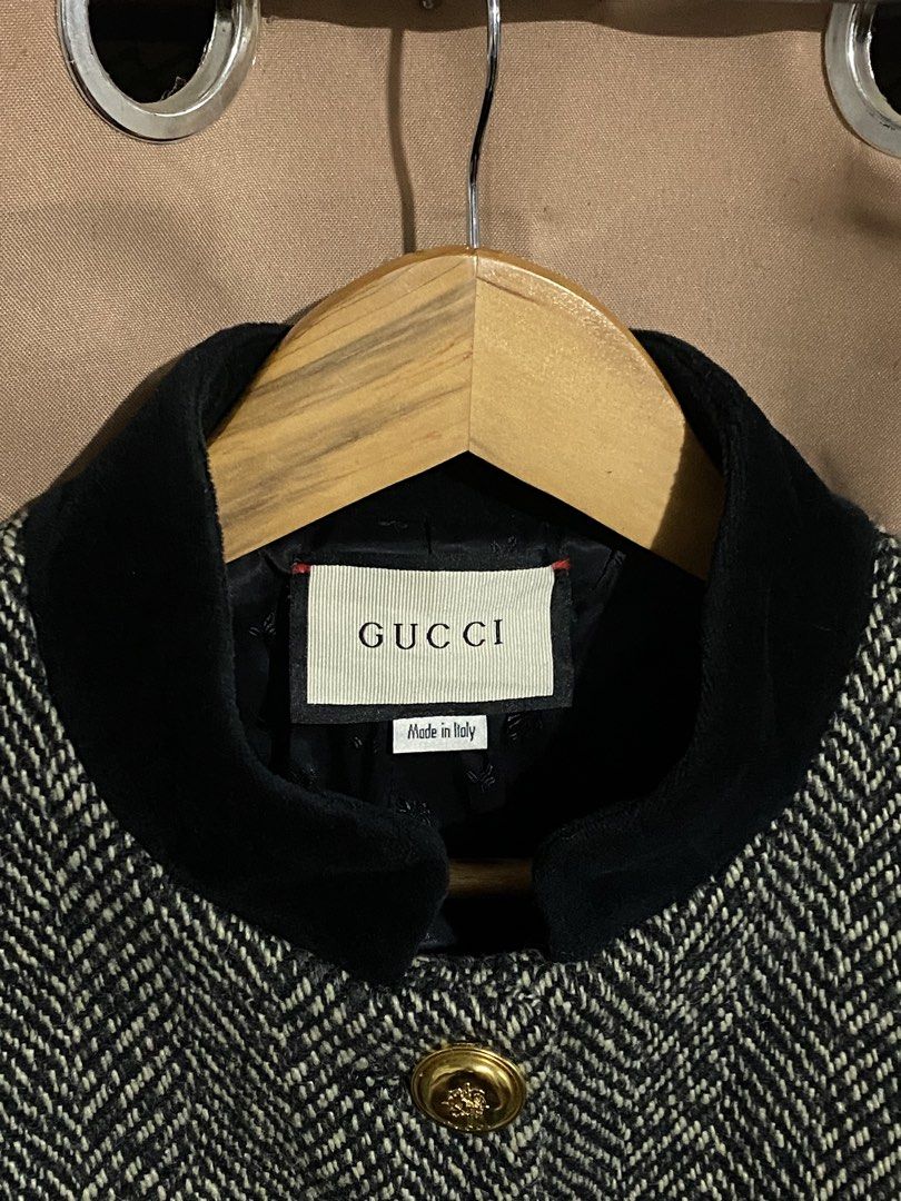 Gucci Herringbone Tweed Jacket (Category: Coats, Jackets and Outerwear) located in Manila. Submitted by why_notph (Listing ID 1468420158, Image 2). Description: - Brand: Gucci - Style: Cropped jacket in black & white herringbone wool - Details: Black velvet stand-up collar and matching pocket trims - Accents: Gold-tone crest buttons on front and white cotton cuffs - Interior: Black monogram pattern lining - Origin: Made in Italy - Size: Medium - 