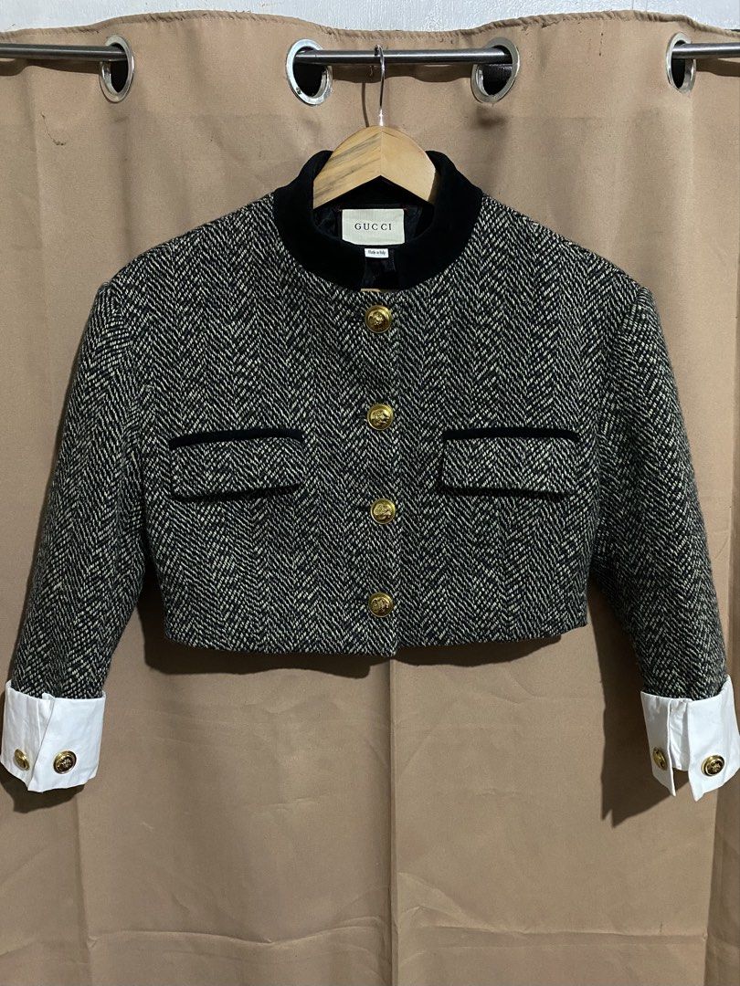 Gucci Herringbone Tweed Jacket (Category: Coats, Jackets and Outerwear) located in Manila. Submitted by why_notph (Listing ID 1468420158, Image 1). Description: - Brand: Gucci - Style: Cropped jacket in black & white herringbone wool - Details: Black velvet stand-up collar and matching pocket trims - Accents: Gold-tone crest buttons on front and white cotton cuffs - Interior: Black monogram pattern lining - Origin: Made in Italy - Size: Medium - 