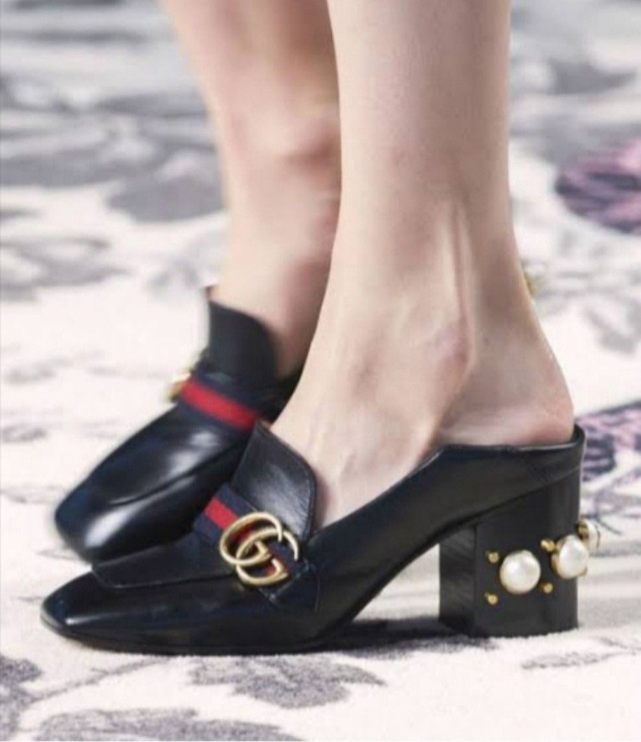 Gucci Loafer Mules (Category: Loafers) located in Batangas. Submitted by thriftshop_izy15 (Listing ID 1468336723, Image 1). Description: - Brand: Gucci - Style: Black leather loafers with square toe - Details: Signature red and green web stripe with interlocking GG hardware - Heels: Chunky block heels decorated with pearls and studs - Condition: Soles show unused - Perfect statement shoes for any chic outfit - Size:35/ 22cm.