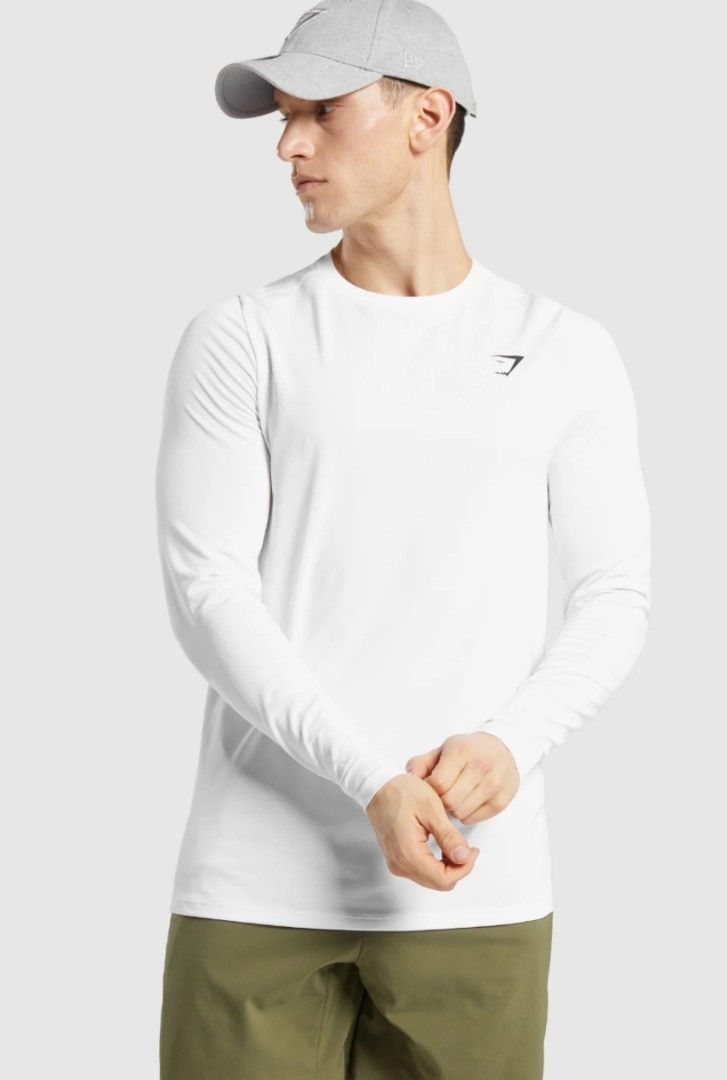 GYMSHARK LONG-SLEEVE PERFORMANCE TOP (Category: Activewear) located in Pagsanjan. Submitted by thriftyclothes33 (Listing ID 1468438769, Image 3). Description: 🔥 GYMSHARK LONG-SLEEVE PERFORMANCE TOP 🤍💪🦈🦈🦈🦈🦈 ✨ Clean white color with black shark logo ✨ Classic crew neck design ✨ Raglan sleeves for better mobility ✨ Stretchy performance fabric ✨ Great for gym, training & everyday wear 🏷️ Size Small on tag 📏 Width 19" (Stretchy) • Length 26"
