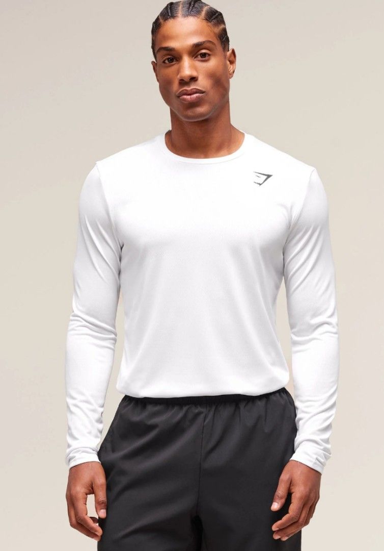 GYMSHARK LONG-SLEEVE PERFORMANCE TOP (Category: Activewear) located in Pagsanjan. Submitted by thriftyclothes33 (Listing ID 1468438769, Image 1). Description: 🔥 GYMSHARK LONG-SLEEVE PERFORMANCE TOP 🤍💪🦈🦈🦈🦈🦈 ✨ Clean white color with black shark logo ✨ Classic crew neck design ✨ Raglan sleeves for better mobility ✨ Stretchy performance fabric ✨ Great for gym, training & everyday wear 🏷️ Size Small on tag 📏 Width 19" (Stretchy) • Length 26"