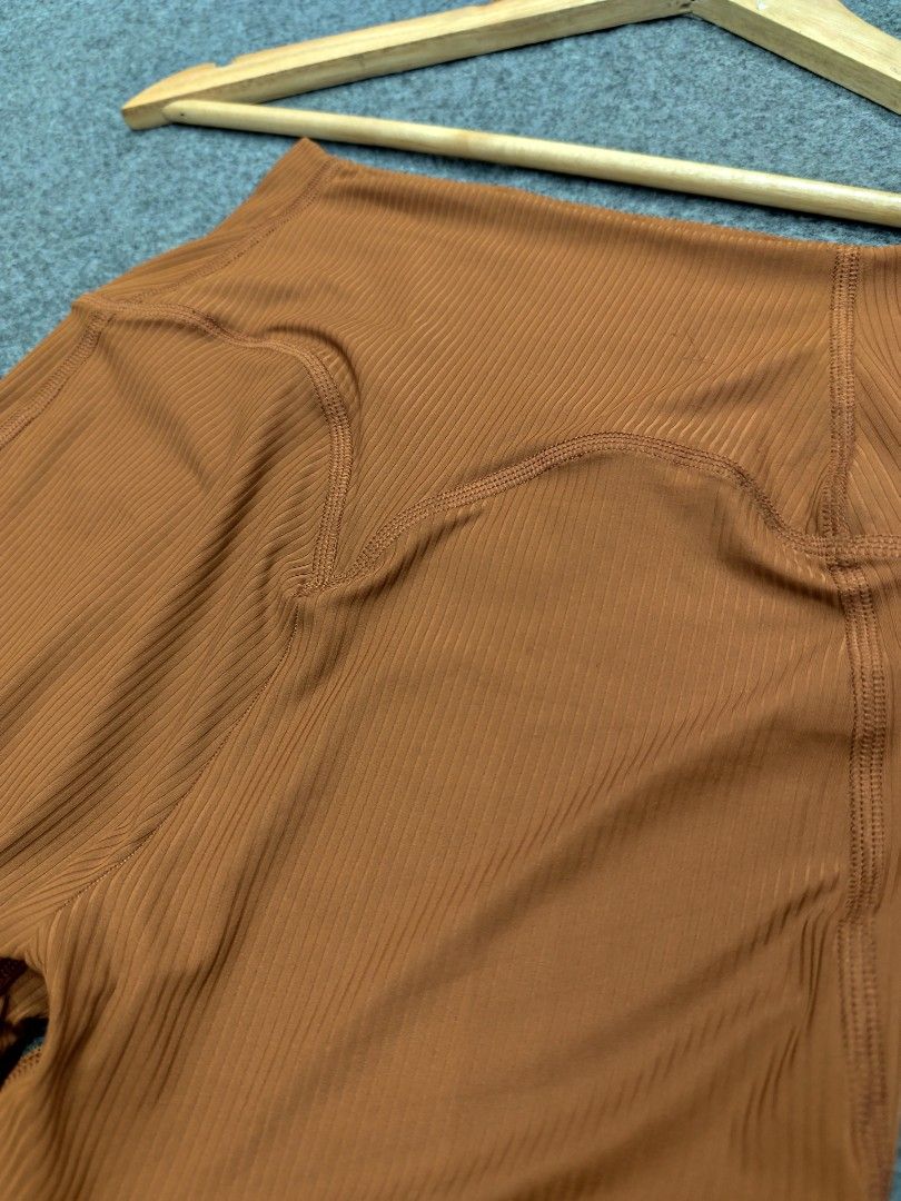 Gymshark Ribbed Leggings Brown (Category: Activewear) located in Cordova. Submitted by bsb.streetluxvintage.clothing (Listing ID 1468425529, Image 3). Description: - Brand: Gymshark - Style: Ribbed high-waisted leggings with supportive back contour stitching - Color: Rich brown - Size: XS - Material: Nylon and elastane blend (super stretchy) - Condition: Great, perfect for workouts or casual lounging - PM for shipping details or bundled items!.
