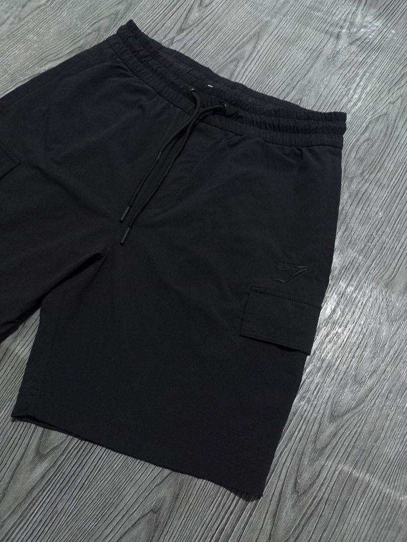 Gymshark Short (Category: Activewear) located in Danao, Cebu. Submitted by 6000thrifts.ph (Listing ID 1468315855, Image 2). Description: Gymshark Stretch Woven Cargo Short 📥 Size Small Waistline 30-34 (Strechable) Length 19 / Embroidery Logo Good Excellent Condition No issue/ Color rate 9.5/10 Pm for the price 📥.