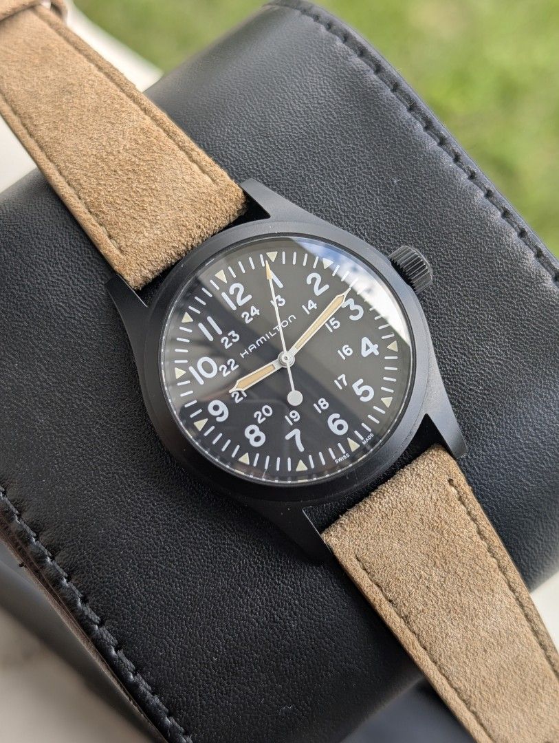Hamilton Khaki Field 38mm (Category: Luxury Watches) located in Valenzuela. Submitted by watchdmd (Listing ID 1468343403, Image 1). Description: Selling this pre-owned but very good condition Hamilton Khaki Field 38mm PVD coated case 38mm case 20mm lug width Dial: Black military-style dial with white Arabic numerals (12-hour and 24-hour scales) and triangular index markers featuring old-radium-colored Super-LumiNova Aftermarket suede leather stra