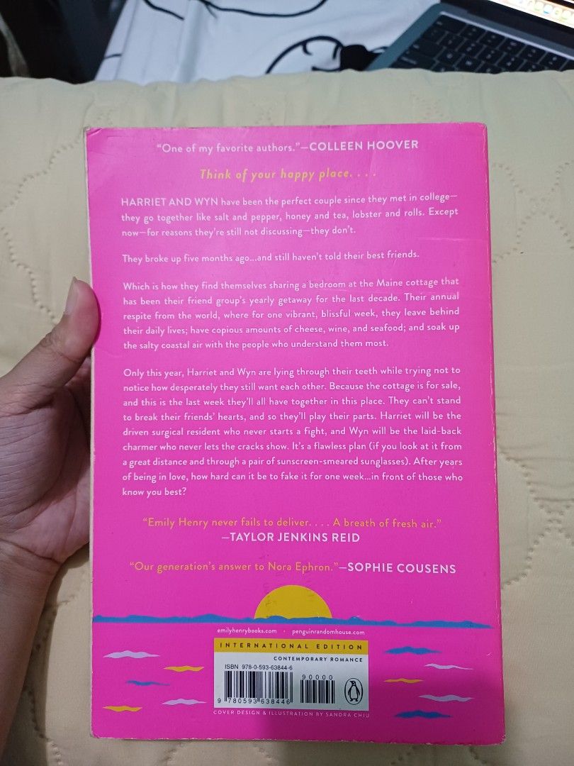 Happy Place by Emily Henry Novel (Category: Storybooks) located in Taguig. Submitted by iy444 (Listing ID 1468416130, Image 2). Description: - Title: Happy Place by Emily Henry - Edition: International paperback edition - Genre: Contemporary Romance (Harriet & Wyn's fake-dating getaway in Maine) - Condition: Readable copy with a sturdy spine - Flaws: Yellowing and foxing on page edges, creasing (water damage.