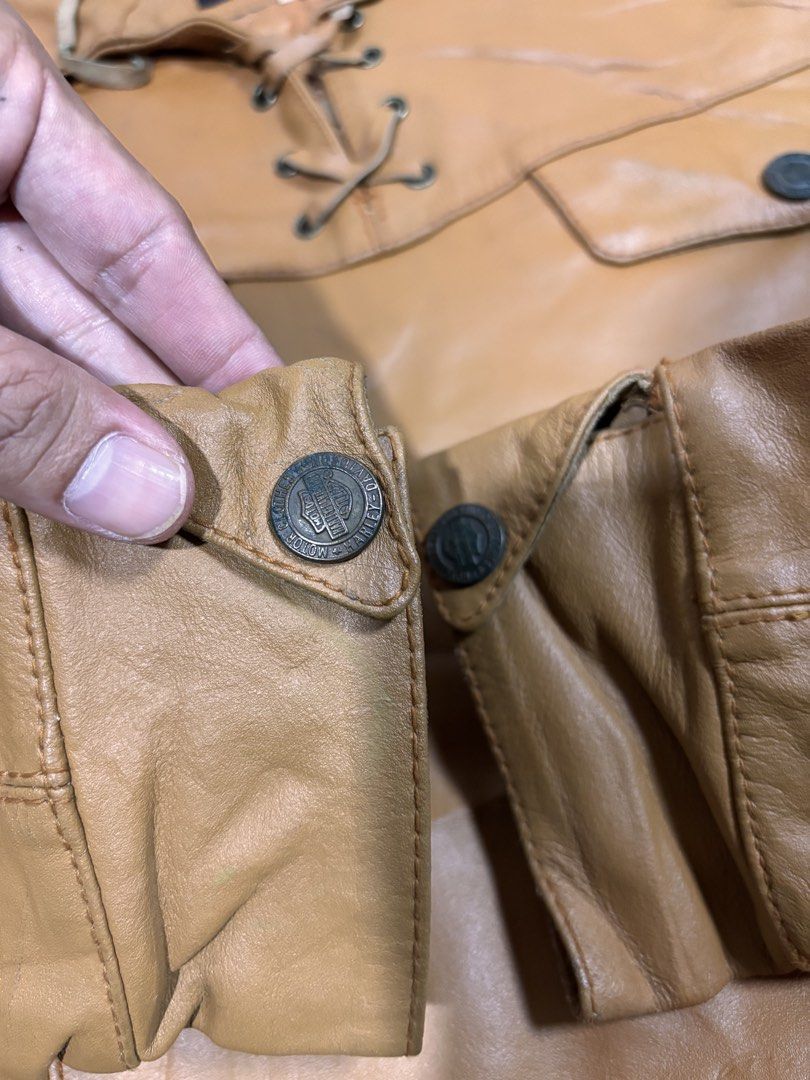 Harley Davidson Tan Leather Jacket Lace-Up Front Size L (Category: Coats, Jackets and Outerwear) located in Mabalacat. Submitted by _limitlessfashion (Listing ID 1468309827, Image 3). Description: - Brand: Vintage Harley-Davidson - Size: Large - Length 23 - Width 23 - No major issue, sign of use only - Color: Tan with natural vintage creasing and wear lines - Material: Genuine leather with cozy quilted lining - Closure/Neck: Front lace-up detail 