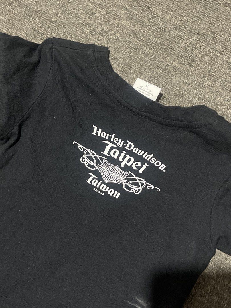 Y2K Harley-Davidson Baby Tee (Category: Shirts) located in Liliw. Submitted by j444mes (Listing ID 1468458122, Image 3). Description: - Brand: Official Harley-Davidson Merchandise - Year: 2016 - Size: 2T (Toddler) - Color: Black - Material: Comfortable cotton blend - Front Design: Biker jacket graphic with zippers, belt, and patches - Back Design: Taipei Taiwan dealership lettering.