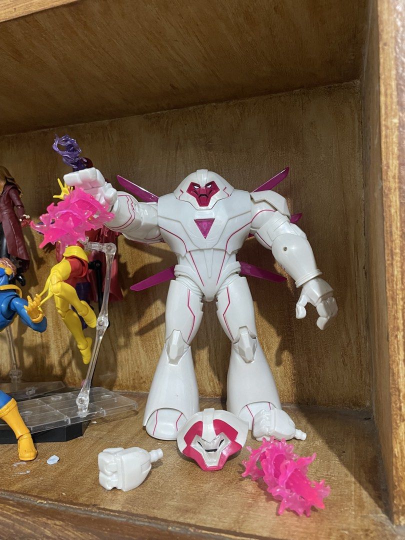 Hasbro Marvel Legends Nimrod (Category: Figurines & Statues) located in Manila. Submitted by cyruscedri44659 (Listing ID 1468477386, Image 1). Description: - Character: Marvel Legends Nimrod - Design: White armor with pink accents and magenta translucent energy effects - Accessories: Includes interchangeable hands and an alternate head - Condition: Solid and tight joints, excellent for display -Issue yellowing since old stock.