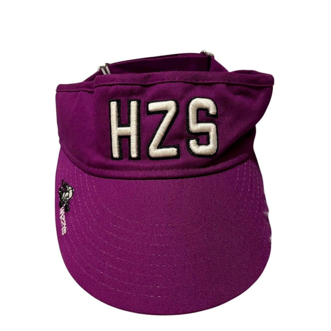 Hazzys Purple Visor Hat HZS (Category: Caps & Hats) located in Cagayan de Oro. Submitted by lootfindzzzz (Listing ID 1468354160, Image 1). Description: - Brand: Hazzys - Color: Bright purple - Design: Bold white HZS lettering embroidered on front, small dog logo on the left brim - Fit: Adjustable strap closure at the back - Condition: Clean fabric with neat stitching throughout - Best for: Sunny outdoor days, golf, or casual streetwear looks.