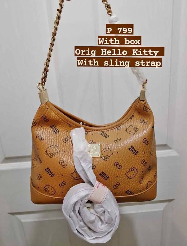 Hello Kitty Monogram Tan Shoulder Bag with Chain Strap (Category: Shoulder Bags) located in Manila. Submitted by hisandherscloset2025 (Listing ID 1468461859, Image 3). Description: - Authentic Kitty shoulder bag in a stylish tan colorway - Includes a chic gold chain handle for hand or shoulder wear - Comes with an extra sling strap (still wrapped in protective plastic) - Interior features branded fabric lining and a secure zippered pocket - Compl