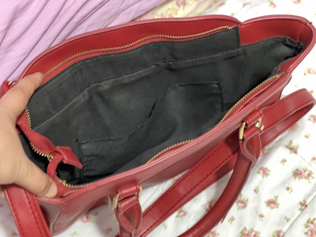 Hello Kitty Red Satchel Shoulder Bag (Category: Shoulder Bags) located in Pasig City. Submitted by morilove (Listing ID 1468298082, Image 3). Description: - Material: Red faux leather with Kitty front graphic - Hardware: Gold-tone - Closure: Zipper closure with top handles - Strap: Includes matching adjustable shoulder strap - Dimensions: Approx. 13 inches across x 10 inches tall - Interior: Clean black fabric lining with organizational pockets -