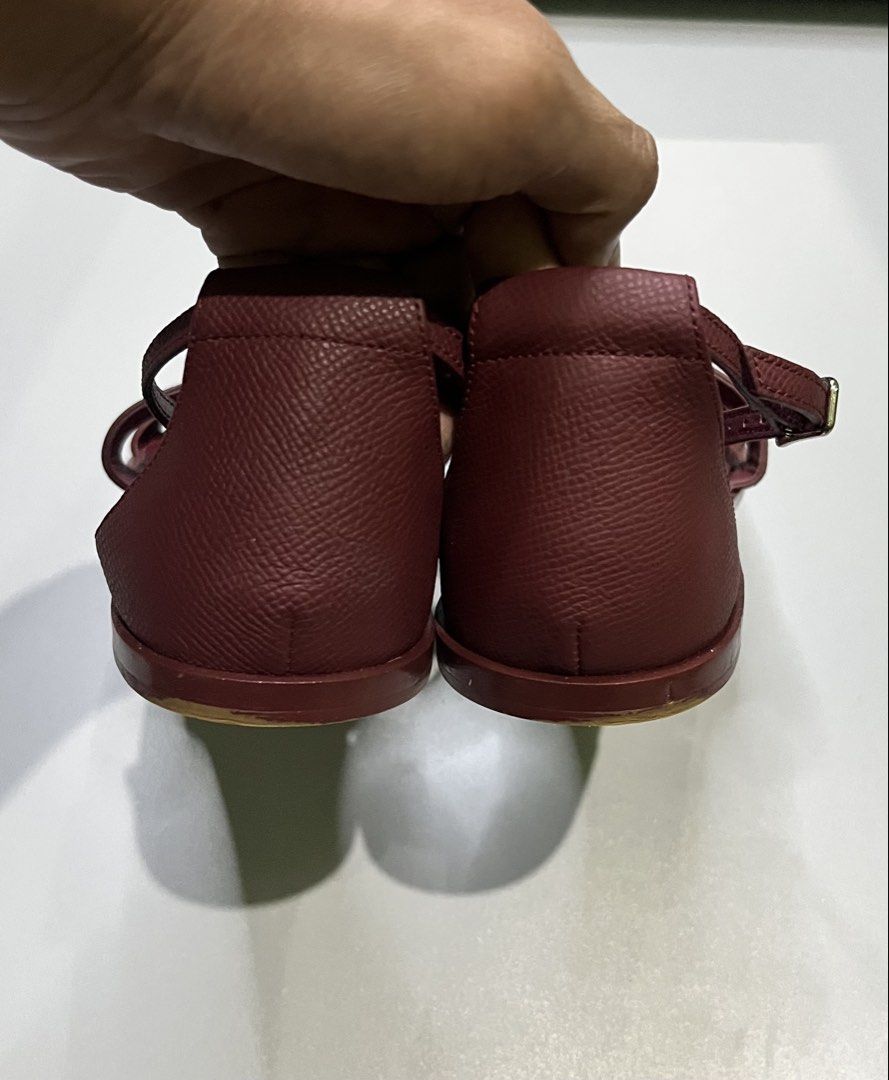 Hermès Santorini Flat Sandals (Category: Flats & Sandals) located in Pagadian. Submitted by lifetalirongan (Listing ID 1468294954, Image 3). Description: Hermès Santorini Flat Sandals in Rouge H (deep burgundy/red) Epsom calfskin leather, featuring the iconic “H” cut-out and an adjustable ankle strap..
