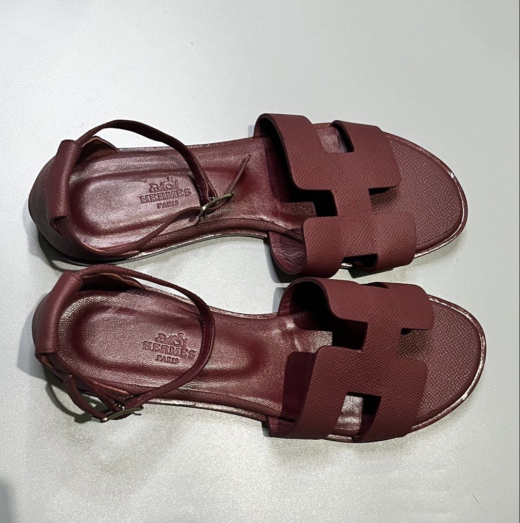 Hermès Santorini Flat Sandals (Category: Flats & Sandals) located in Pagadian. Submitted by lifetalirongan (Listing ID 1468294954, Image 2). Description: Hermès Santorini Flat Sandals in Rouge H (deep burgundy/red) Epsom calfskin leather, featuring the iconic “H” cut-out and an adjustable ankle strap..