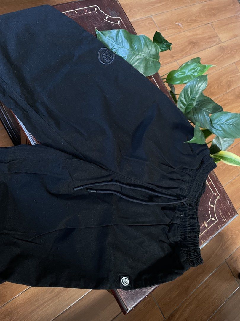 Highminds Black Pants with Drawstring and Pocket Label (Category: Joggers) located in Manila. Submitted by barrybalenshagga (Listing ID 1468354889, Image 2). Description: size 2XL (34-36) - Brand: Highminds - Color: Black - Fit: Relaxed fit for daily comfort - Waistband: Elastic with adjustable drawstring - Pockets: Includes back pocket with white Highminds brand tag - Details: Round embroidered logo near the hip and small patch label near the he