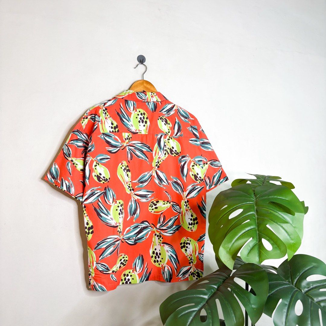 Hisso | Open Collar Polo. (Category: Tshirts & Polo Shirts ) located in Manila. Submitted by bypiecesandstories (Listing ID 1468322964, Image 2). Description: Hisso | Open Collar Polo. 599 PHP 🧡 Perfect Condition Can Fit — Medium to X Large Dimensions — W 23" L 28" A vibrant orange printed polo with an open collar and a relaxed fit and laid-back feel. Perfect for adding a pop of color and personality to your everyday wardrobe. • REMINDERS • — Re