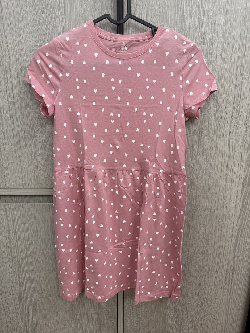 H&M Basic Organic Cotton Pink Heart Dress (Category: Dresses) located in Pasig City. Submitted by jeymi88 (Listing ID 1468409918, Image 1). Description: - Brand: H&M Basic - Condition: Brand new with tag attached - Design: Pink dress with all-over small white hearts - Features: Round neckline, short sleeves, gathered skirt drop waist - Material: 100% organic cotton - Size: EUR 134/140, US 8, 10Y.