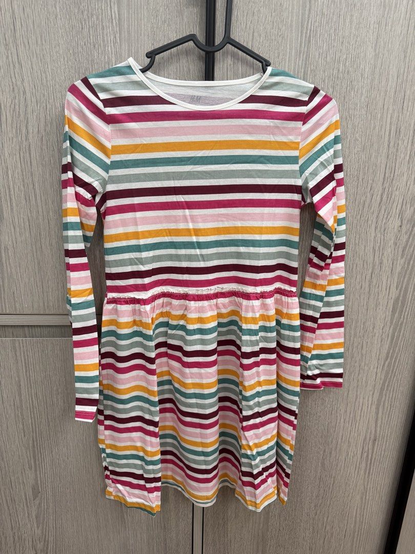 H&M Basic Organic Cotton Striped Long Sleeve Dress (Category: Dresses) located in Pasig City. Submitted by jeymi88 (Listing ID 1468410002, Image 1). Description: - Brand: H&M - Design: Colorful horizontal stripes (pink, yellow, green, dark red) - Material: 100% Organic Cotton - Size: EUR 134/140 (Fits approx. 8-10 years old) - Features: Round neckline, gathered waistline, and flared skirt - Condition: Good as casual wear for school or outings.