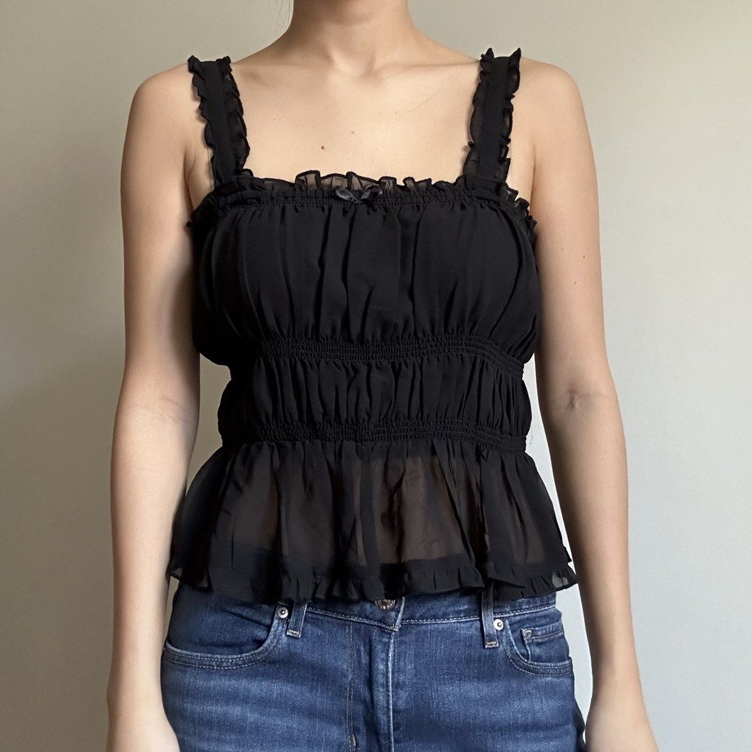 H&M Black Ruffled Camisole (Category: Sleeveless) located in Manila. Submitted by lovedby.k (Listing ID 1468334310, Image 1). Description: 𝗜𝘁𝗲𝗺 𝗗𝗲𝘁𝗮𝗶𝗹𝘀: Condition: 9/10 in mint condition! Size: S on tag - slightly sheer - gaterized/stretchy 𝗠𝗼𝗱𝗲𝗹’𝘀 𝗠𝗲𝗮𝘀𝘂𝗿𝗲𝗺𝗲𝗻𝘁𝘀: Bust 34-36, Size S-M, Height 5’5 🔖 All items are 𝗽𝗿𝗲𝗼𝘄𝗻𝗲𝗱! .
