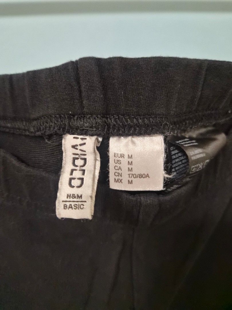 H&M Divided Black Leggings Size M (Category: Activewear) located in Manila. Submitted by prelovedbyc.hannah (Listing ID 1468432786, Image 3). Description: - Brand/Model: H&M Divided - Size: Medium (M) - Color: Classic Black - Fit & Fabric: High elasticity, stretchable, and comfortable elastic waistband - Style: Versatile everyday basic, easy to mix and match.