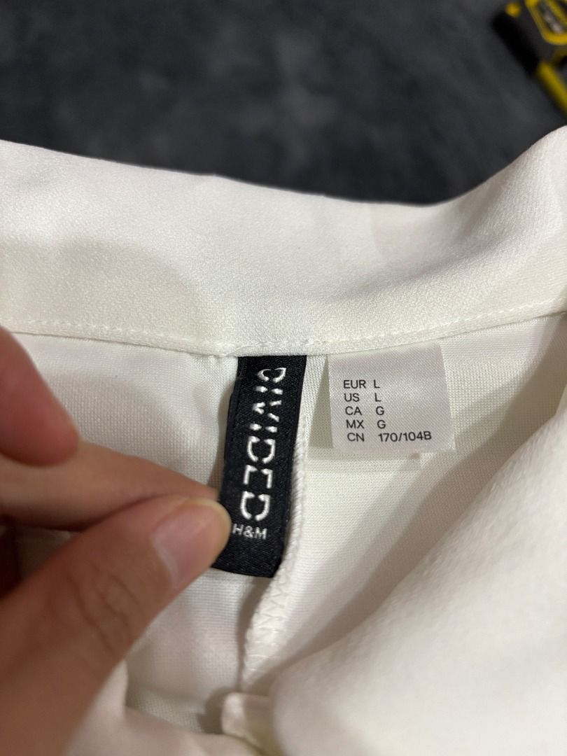 H&M Divided White Collared Short Sleeve Dress (Category: Dresses) located in Antipolo. Submitted by dddeclutter (Listing ID 1468348944, Image 3). Description: - Brand: H&M Divided - Color: White - Style: Collared short sleeve dress with zip-back closure - Size: EUR L / US L / 170/104B - Measurements: ~16" across waist, ~32" total length - Condition: Clean overall, with a few small faint marks near the bottom hem line but can be washed off.
