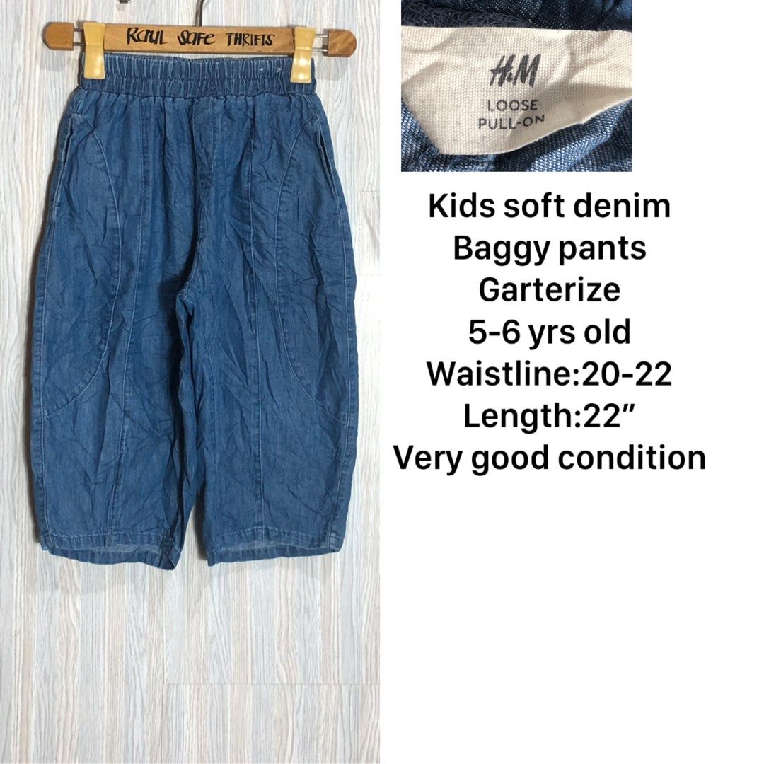 H&M Kids Soft Denim Baggy Pull-On Pants (Category: Babies & Kids Fashion) located in Montevista. Submitted by rdthriftshub (Listing ID 1468377561, Image 3). Description: - Brand: H&M - Item: Loose pull-on baggy pants for kids - Material: Soft denim with comfortable elastic garterized waistband - Size: Fits 5 to 6 years old - Measurements: Waistline 20-22 inches, Length 22 inches - Condition: Very good overall condition.